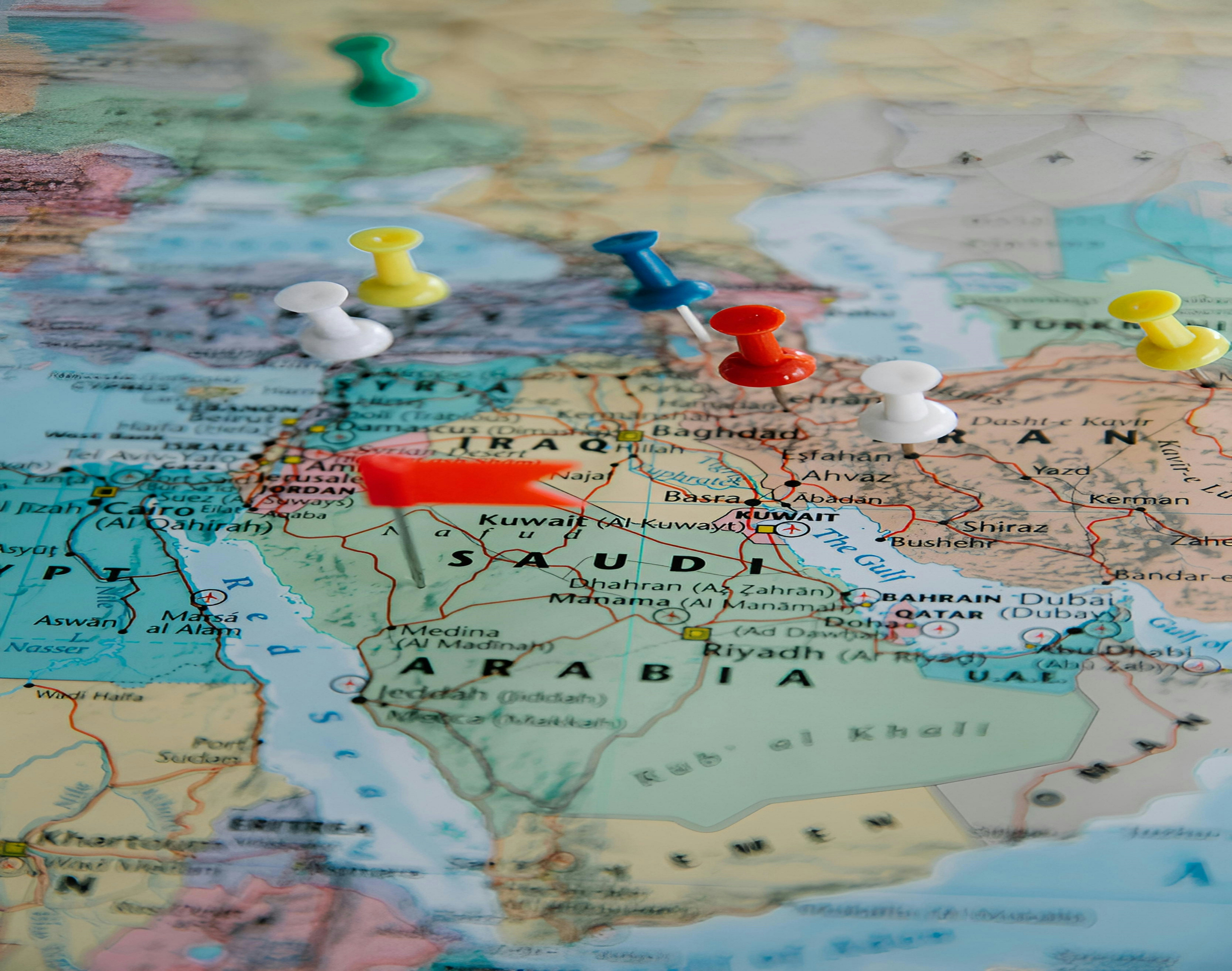 World map with colorful pins marking travel destinations — listing distribution across channels